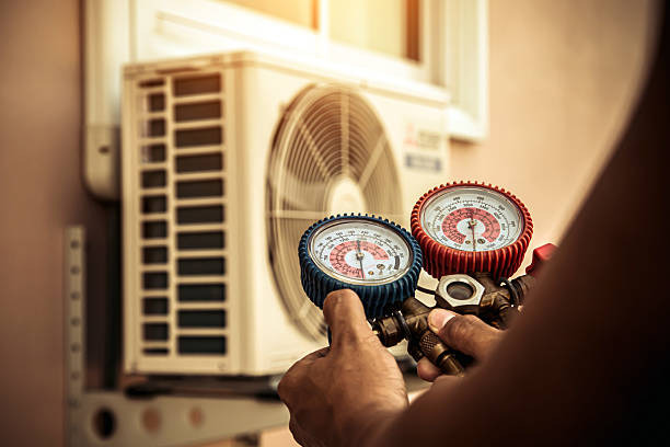 Professional Air Conditioning Service technician working in Jamesport, NY